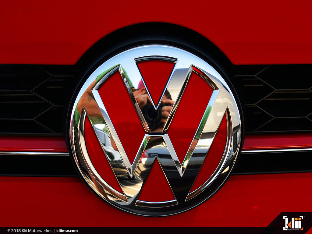 Kyiv, Ukraine - May 29, 2021: Volkswagen car front logo over red